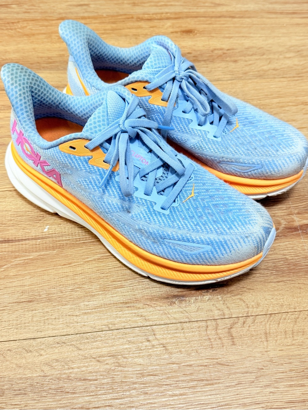 Hoka Women's Light Blue Running Sneakers with Orange Trim